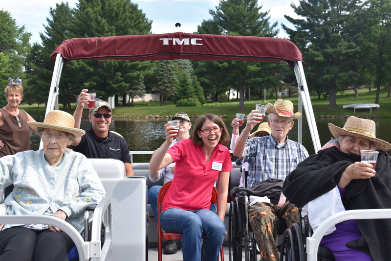 Caretakers and seniors on pontoon boat